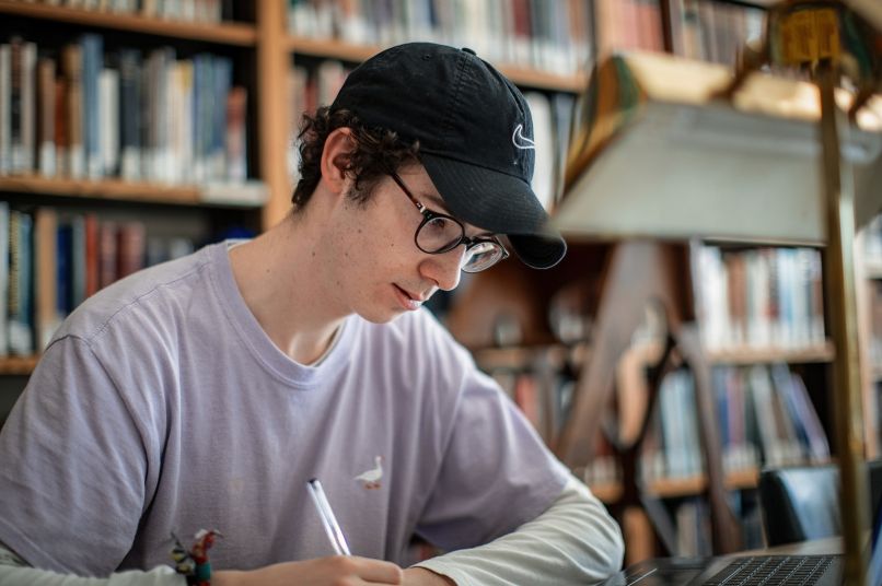 Student revising in the library