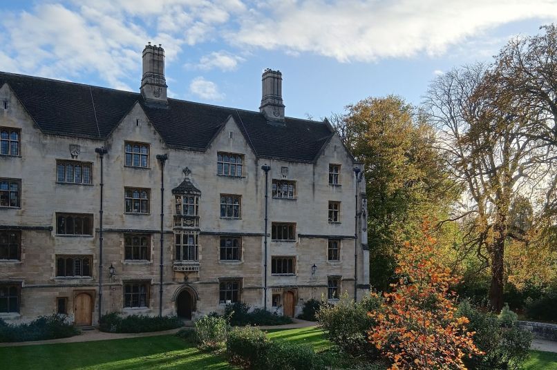 A college building with autumnal trees