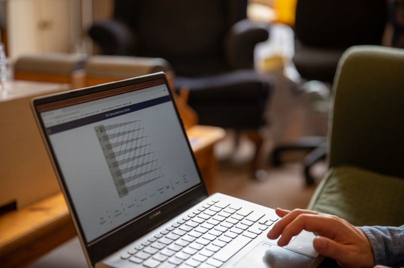 Hand of a student working on a laptop