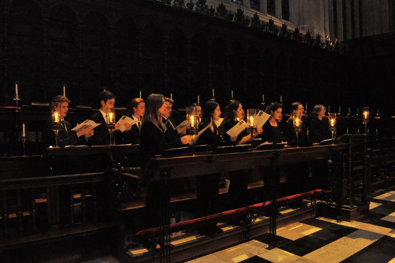 Members of a mixed choir singing 
