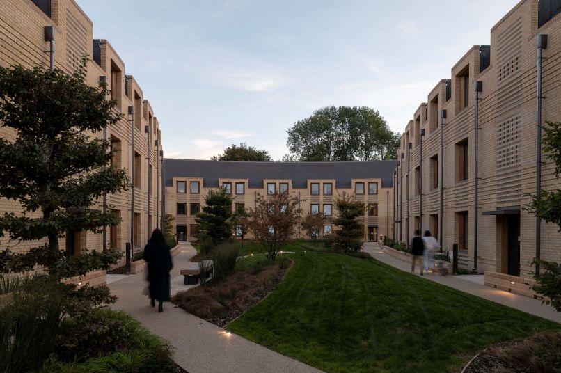 A group of passivhaus accommodation buildings with green space in between