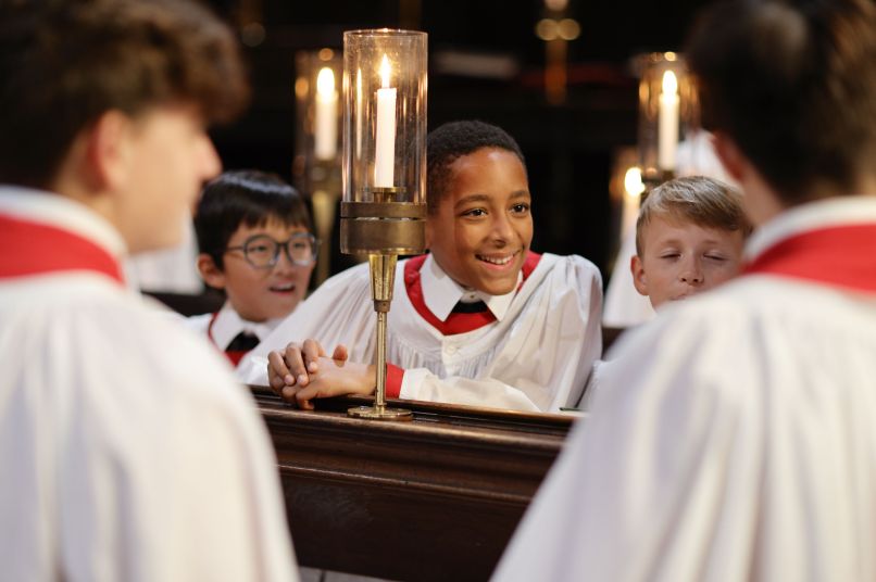 A choir boy smiles 