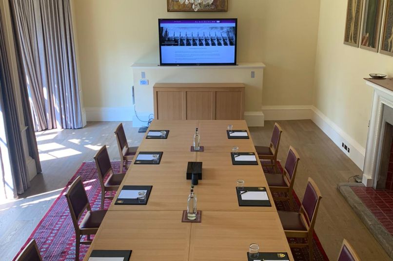 a meeting room with a chandelier