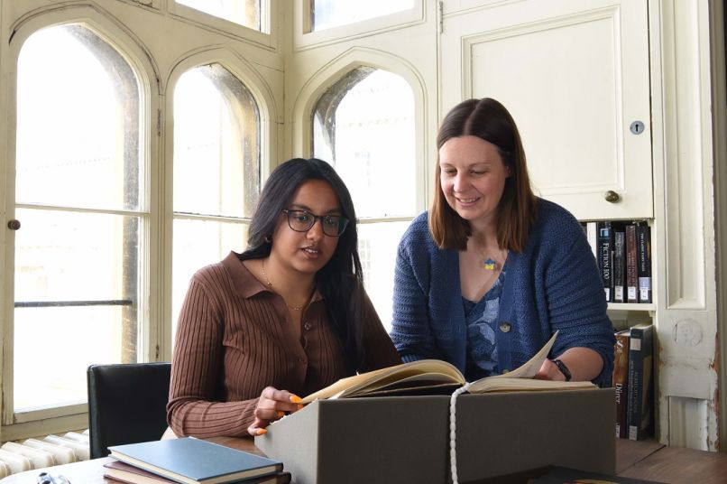 Student working with Tutor at desk