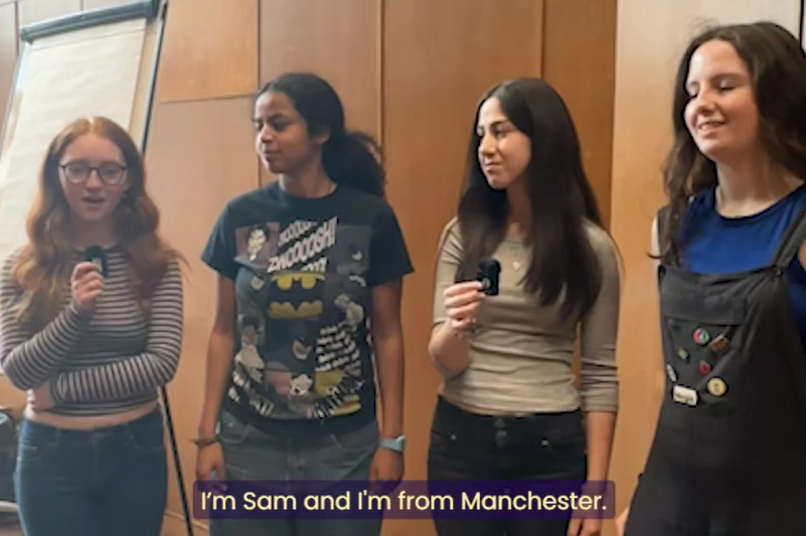 Four students discussing the Calculating Women Residential