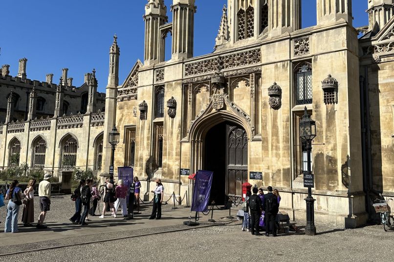 Visitors entering the main gate