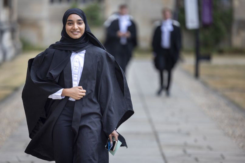 Graduate walking through King's