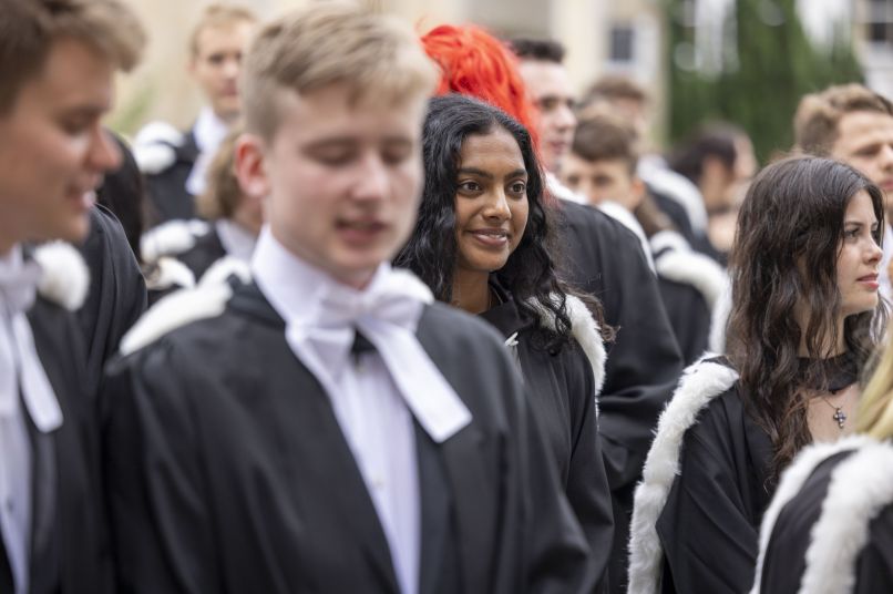 Students in gowns on graduation day