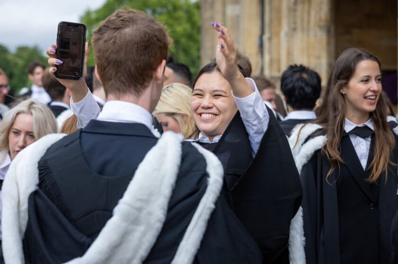 Students smiling at graduation
