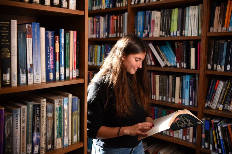 Student reading in the library