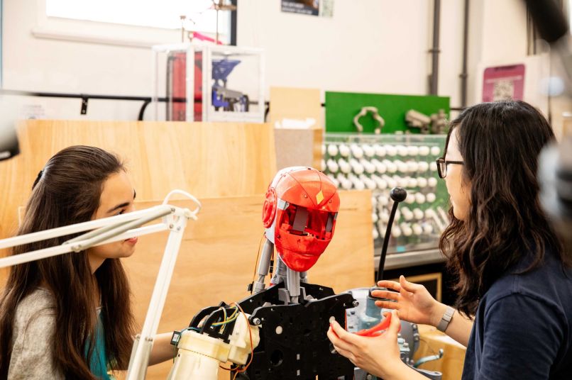 Students with a robot
