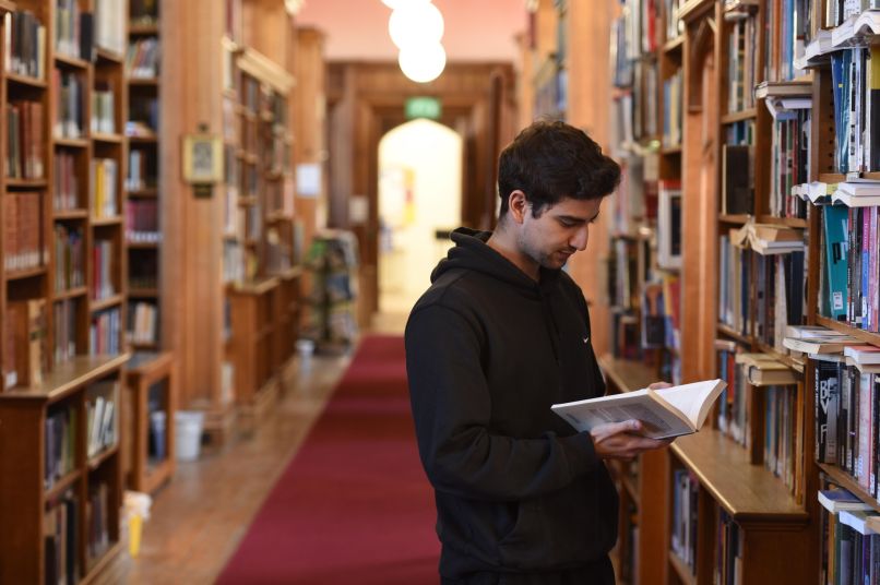 Student reading in the library