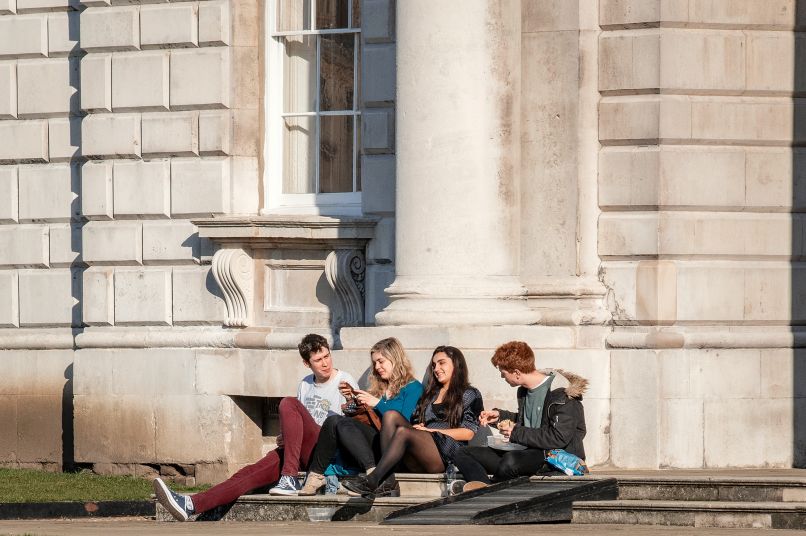 Students sitting on a step