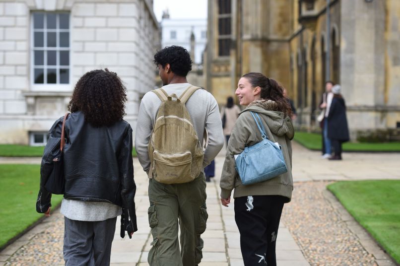 Three students walking together
