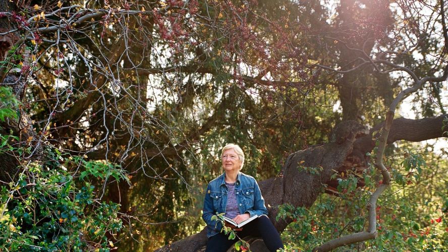 Professor Anne Davis photographed in the Fellows Garden