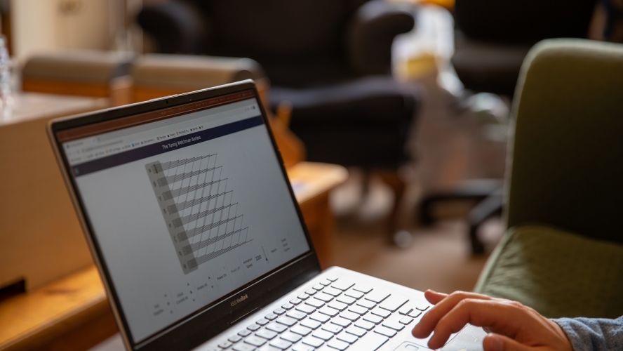 Hands of a student working on a laptop