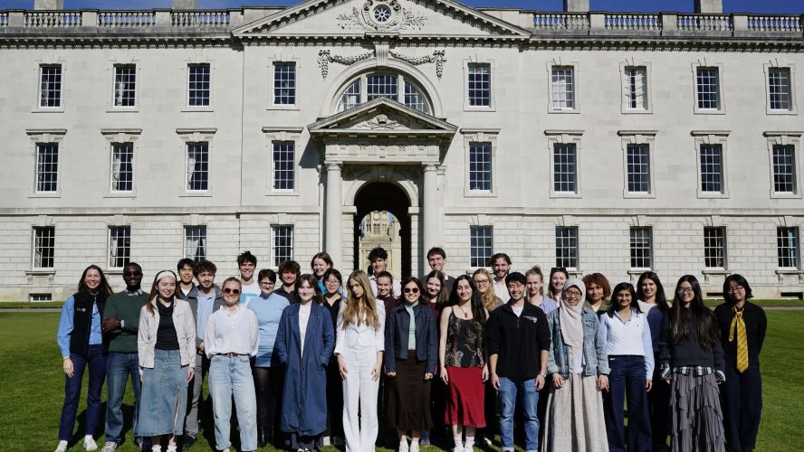Group of students with the E-Lab team standing on the Back Lawn 