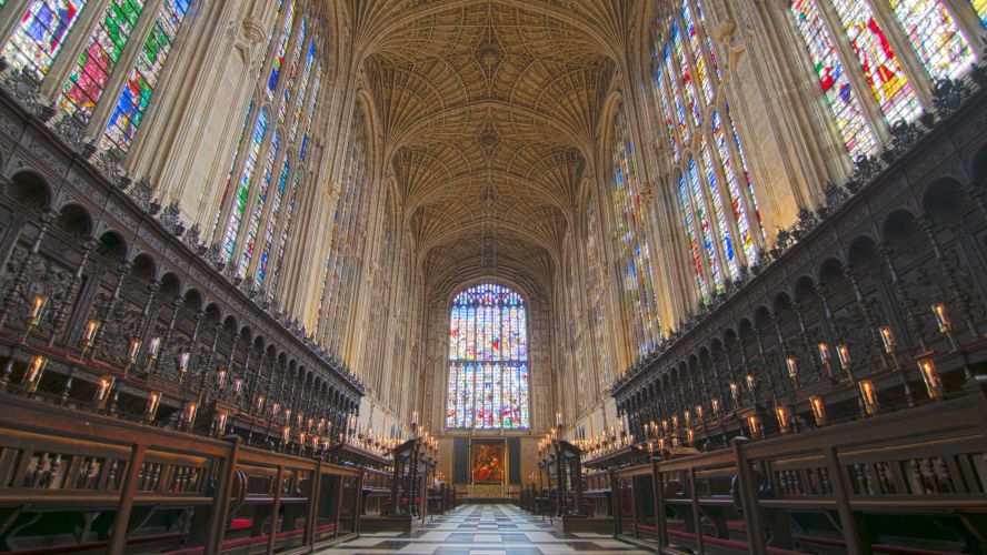 Interior image of King's College Chapel with choir stalls and stained glass windows