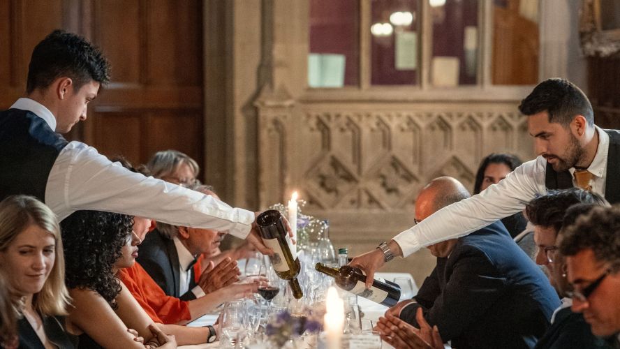 Waiters serving wine 