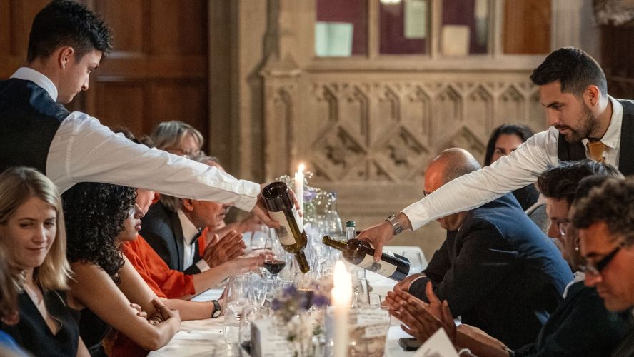 Waiters serving wine 