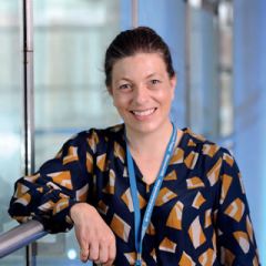 Smiling lady wearing a lanyard