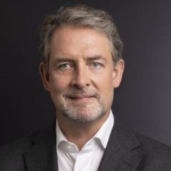 Dapper man in a dark grey suit