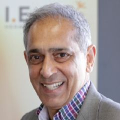 Smiling man in a grey suit