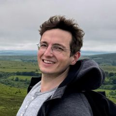 Man smiling standing outdoors