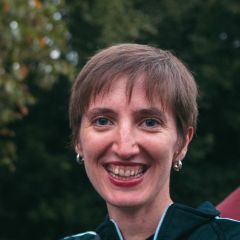 Smiling woman with short brown hair