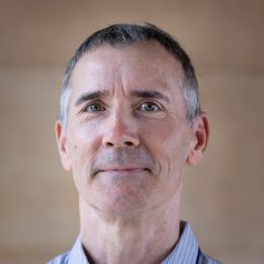 Richard Bourke, a man with short dark greying hair and a blue pinstripe shirt