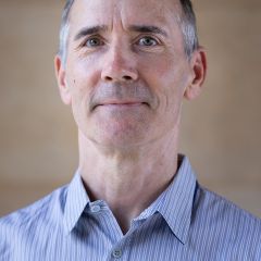 Richard Bourke, a man with short dark greying hair and a blue pinstripe shirt