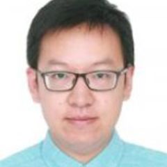 Dong Gang Wang, a man with dark hair and glasses wearing a pale blue shirt