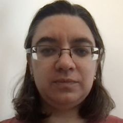 Irina Mohorianu, a woman with shoulder length brown hair and glasses