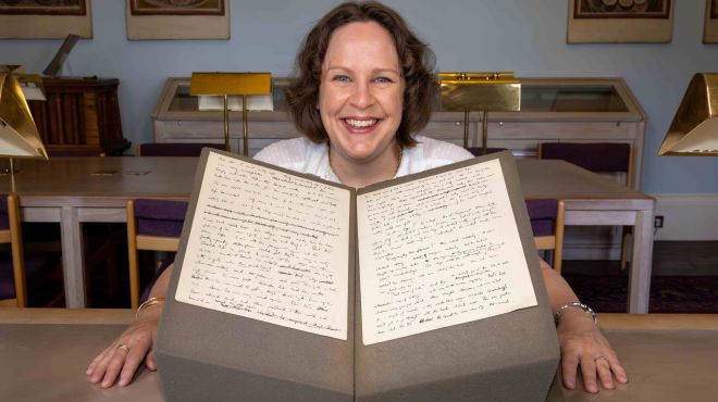 Professor Sarah Dillon with Alan Turing's short story. Photography by Lloyd Mann.