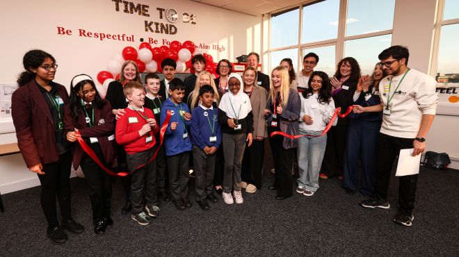 Group of children with King's students and staff formally open the new centre