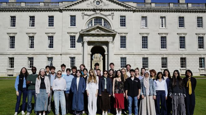 Group of students with the E-Lab team standing on the Back Lawn 