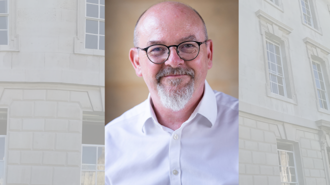 Man with glasses smiling
