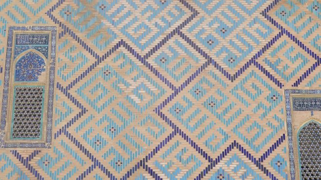 A blue geometric patterned tile mosaic