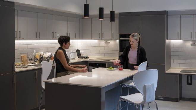 Two graduate students in the kitchen