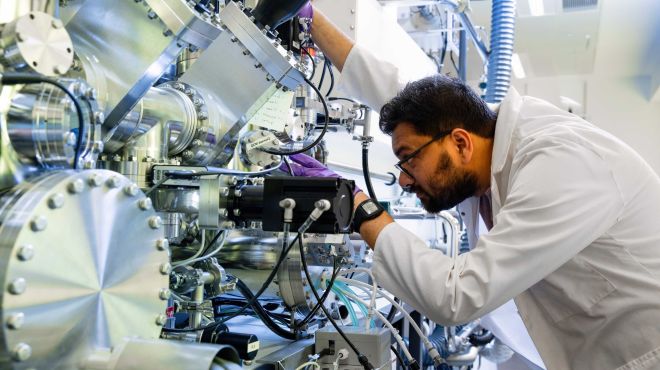 student working on a machine