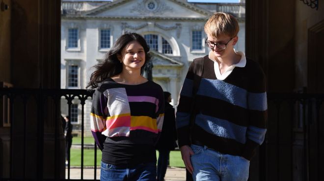 students walking through the front gate of King's College