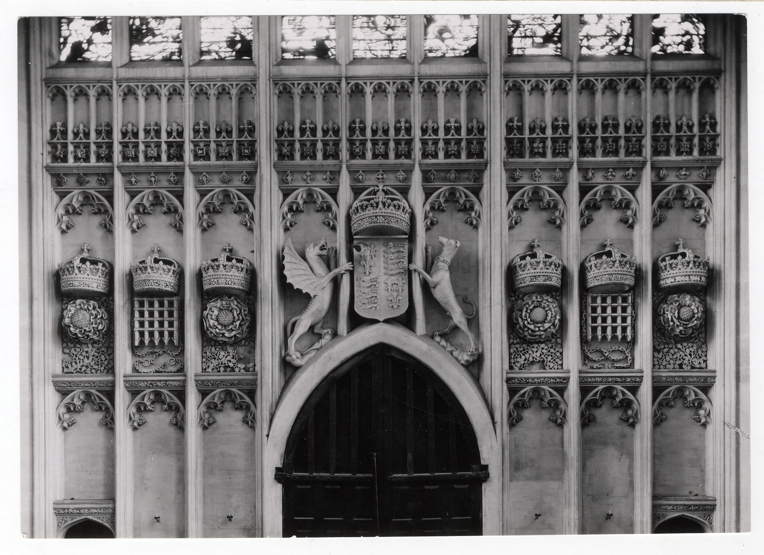 Heraldic carvings on the walls of the antechapel. Photograph: RCHM, 1949. [Coll-Ph-836].