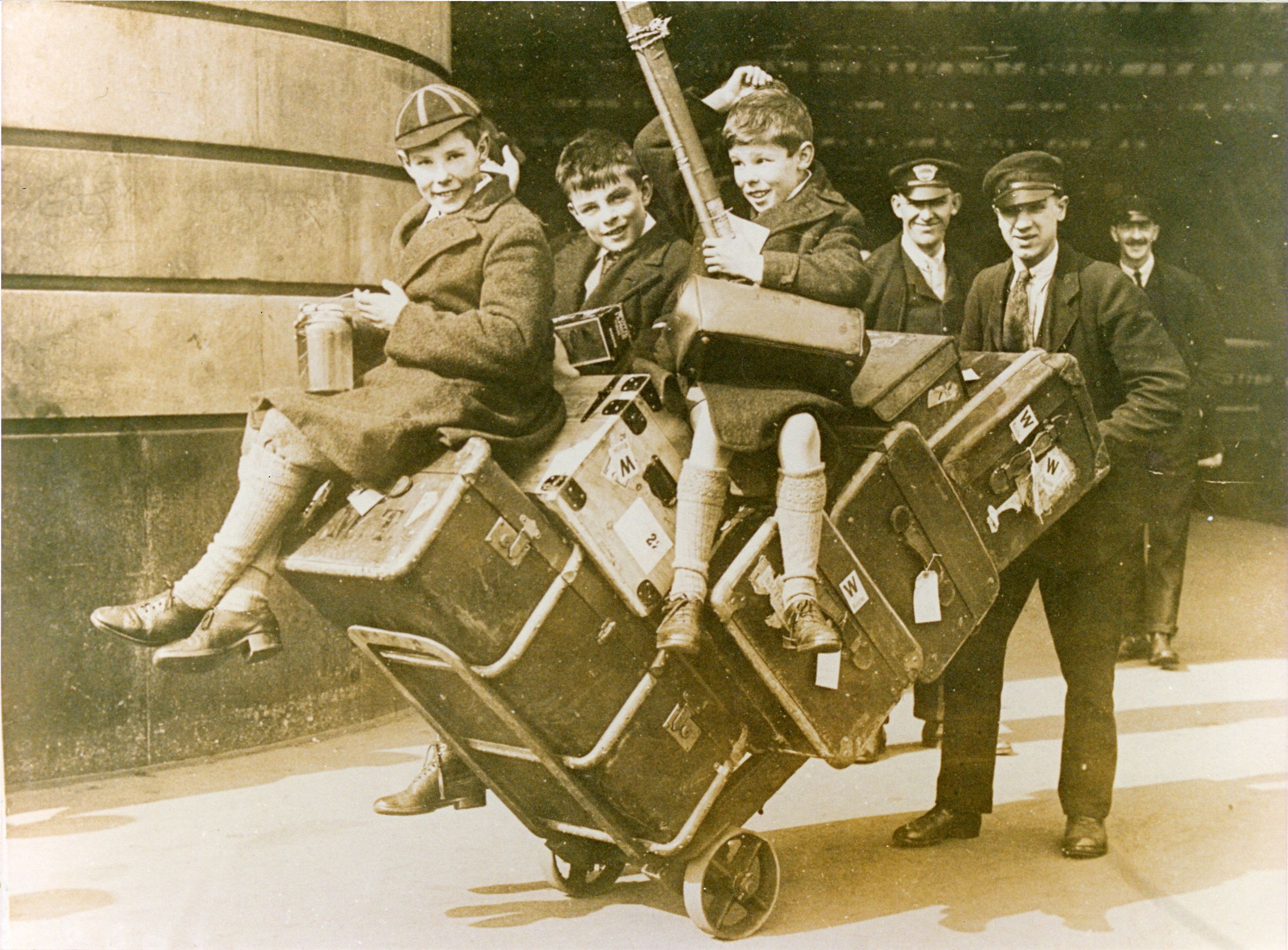 Alan with his school friends Robin and John Wainwright, taken at Waterloo Station on the way to the school carriage at Charing Cross Station. Probably early 1926. [AMT/K/7/28]