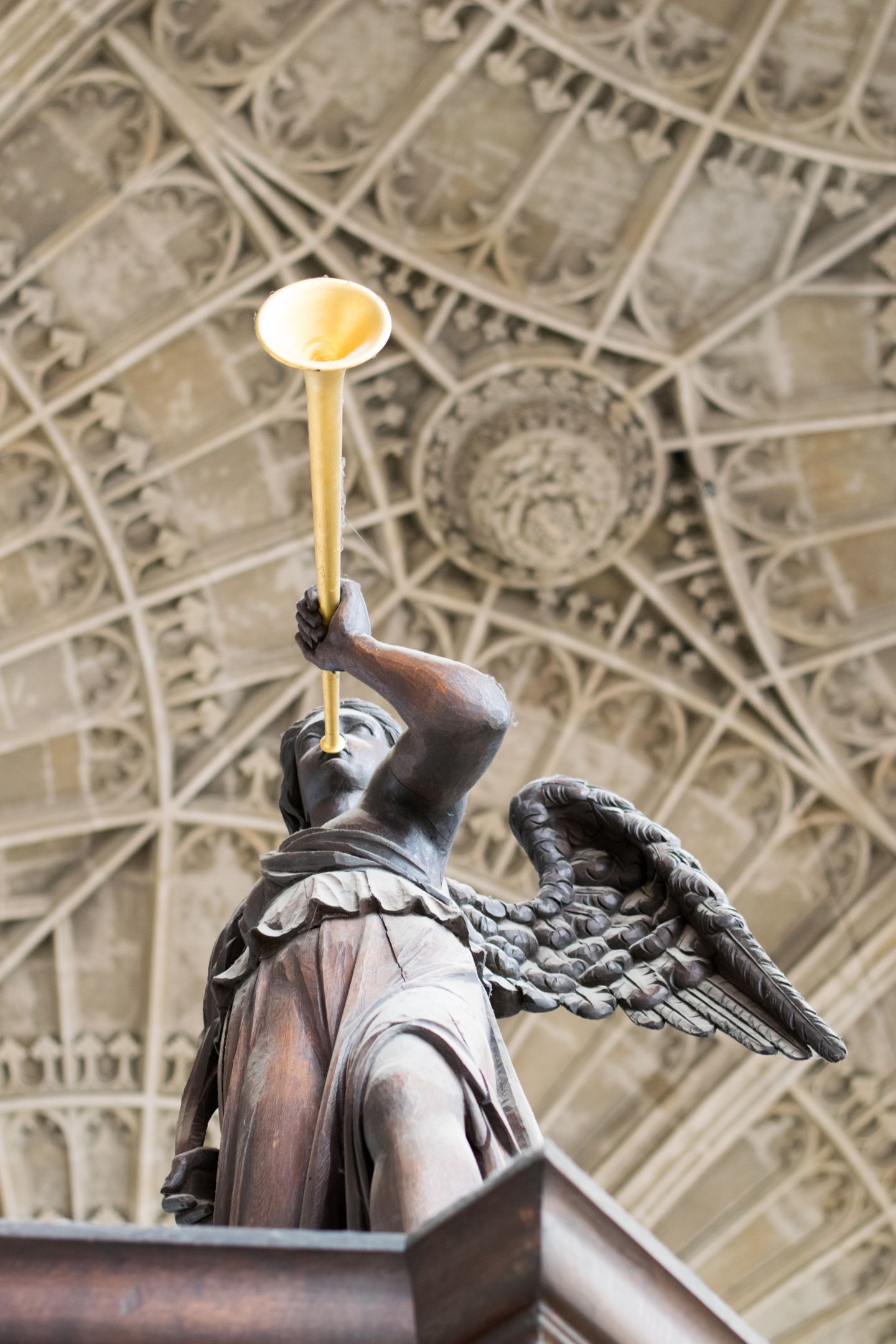 A wooden angel and trumpet 