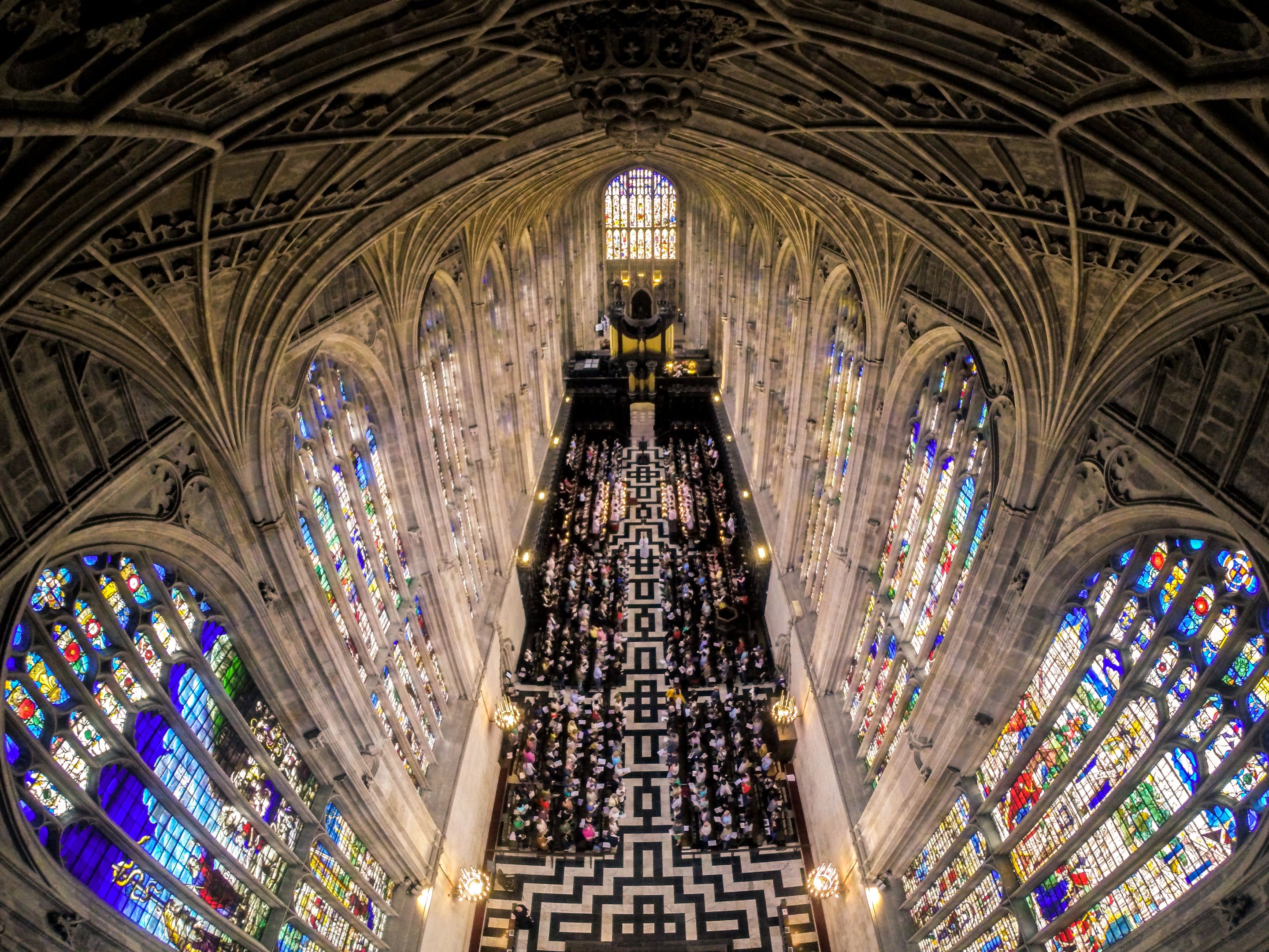 a bird's eye view of an audience in a chapel