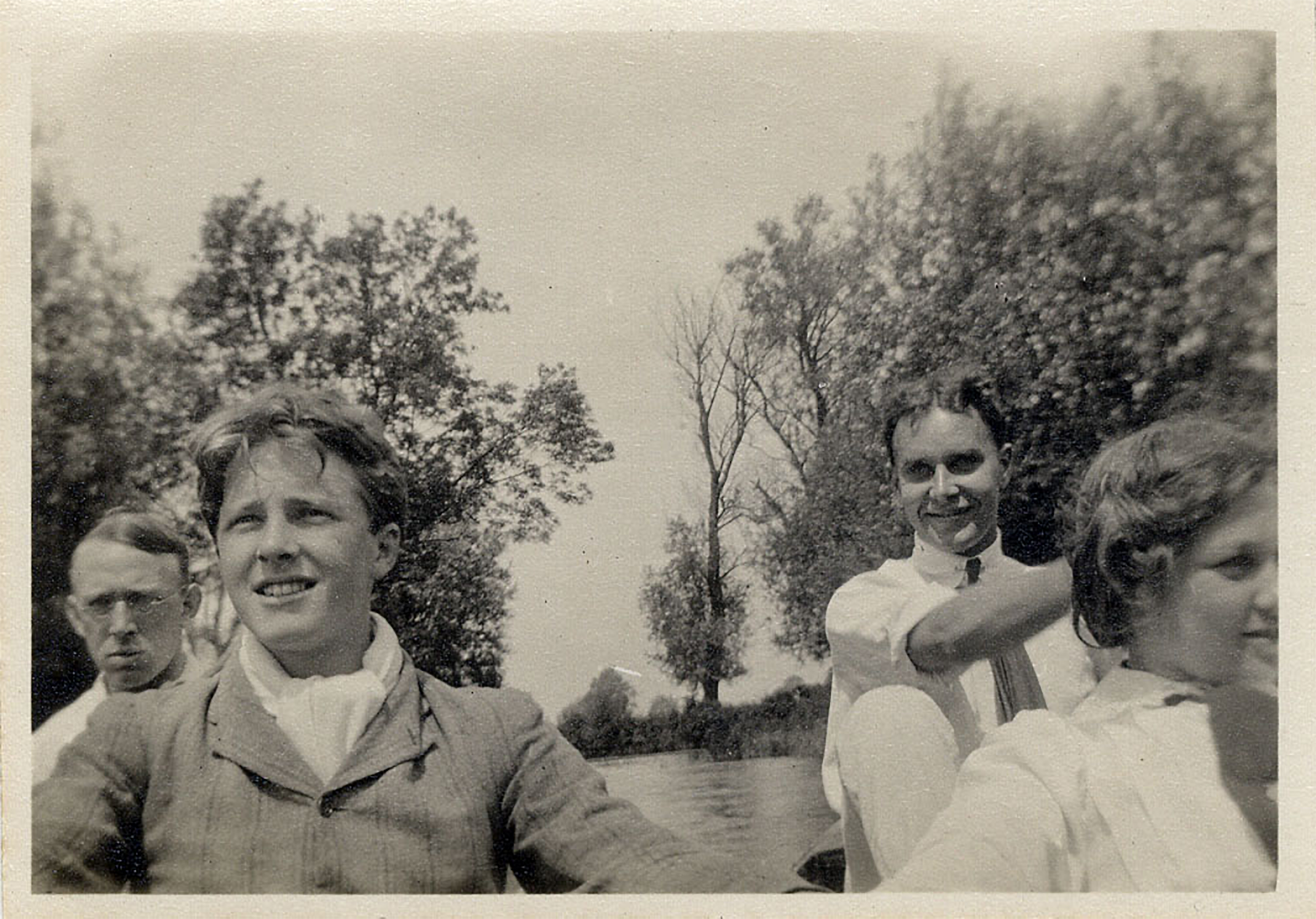 old photo of four people on a punt