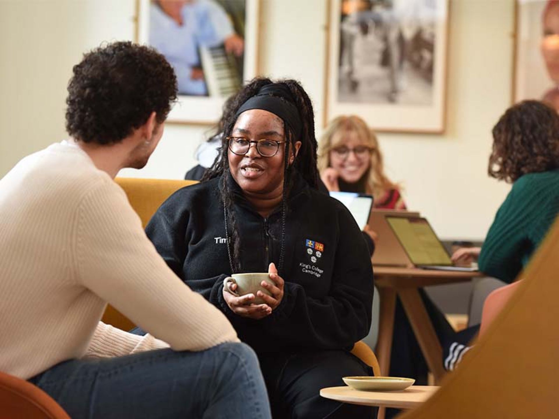 Female student having converstaion with another male student