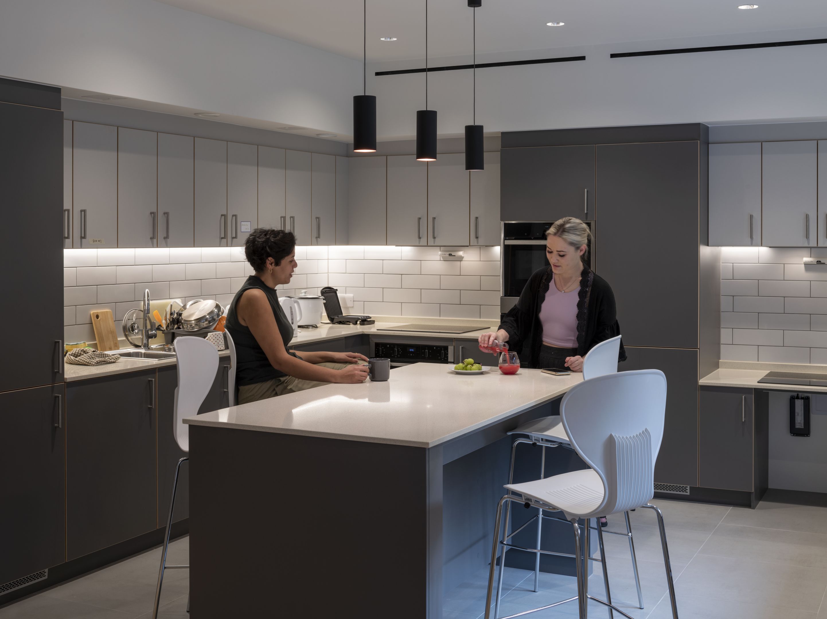 Two graduate students in the kitchen