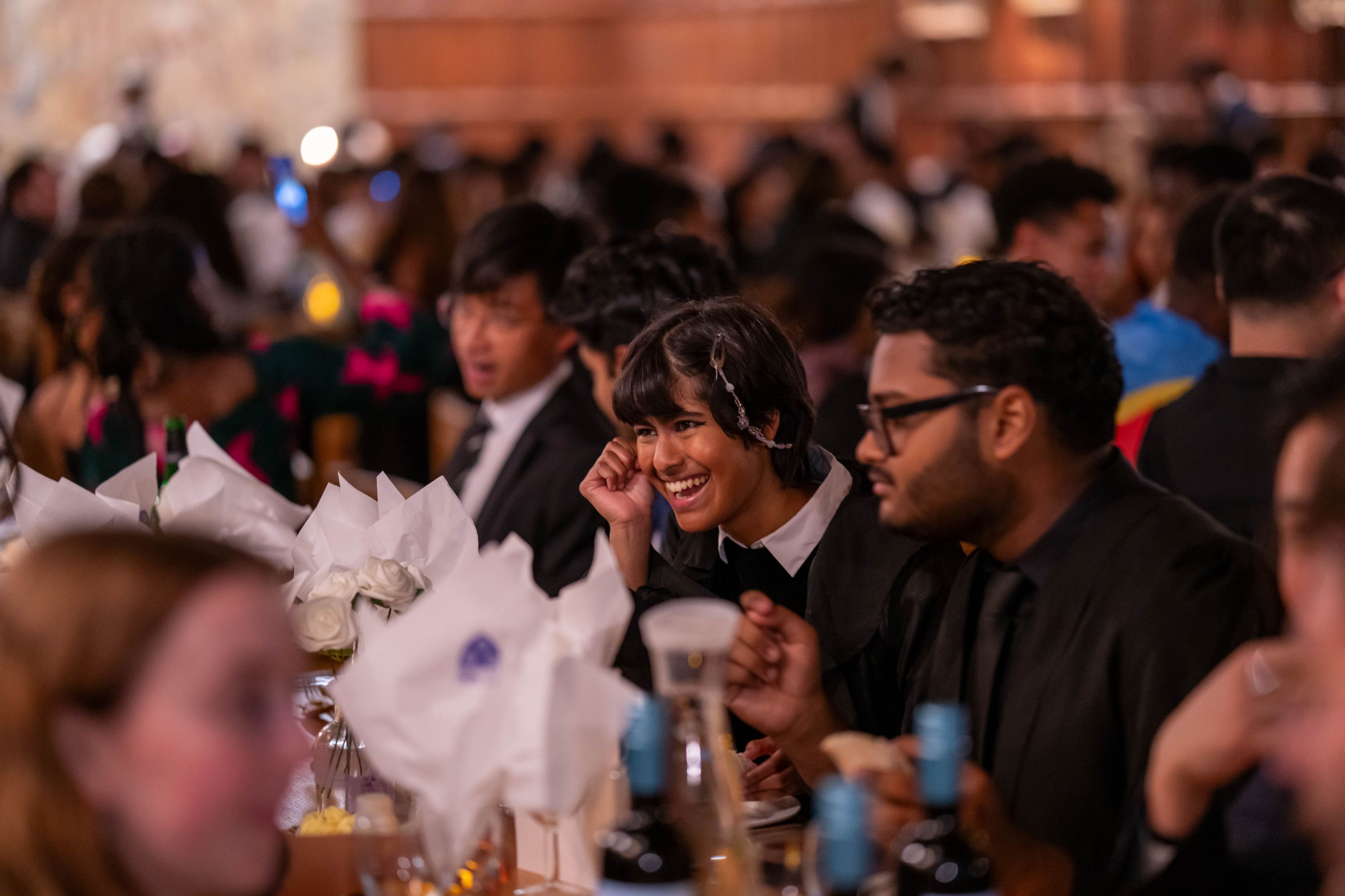 Students dining together at a formal dinner