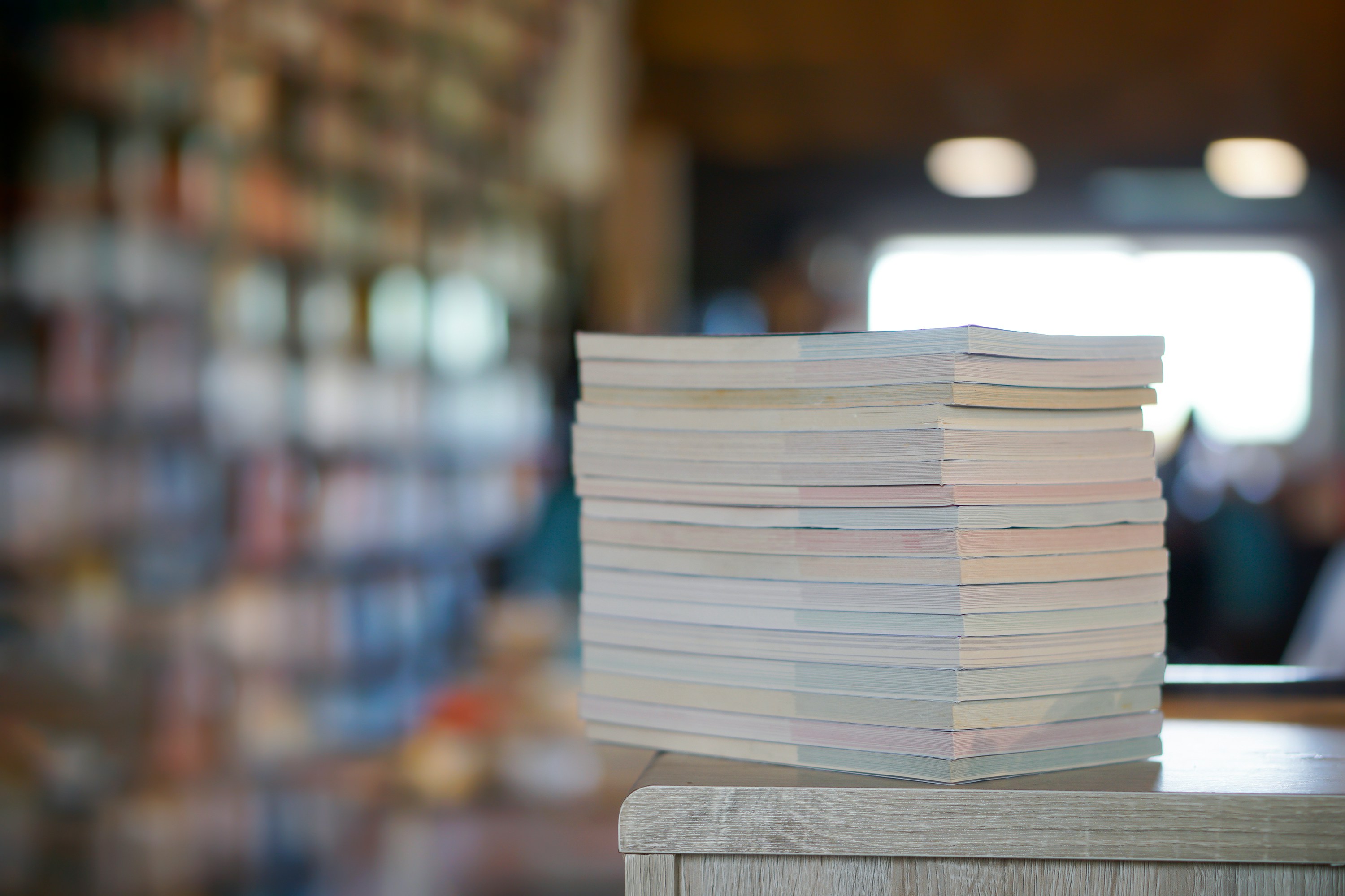 a stack of books on top of a bookcase